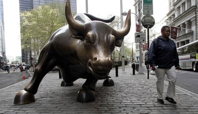 
              FILE This April 21, 2006 file photo shows the statue of the bull, on Wall Street in Downtown Manhattan, New York. The 2008 financial crisis roiled the banking system and swamped the glo